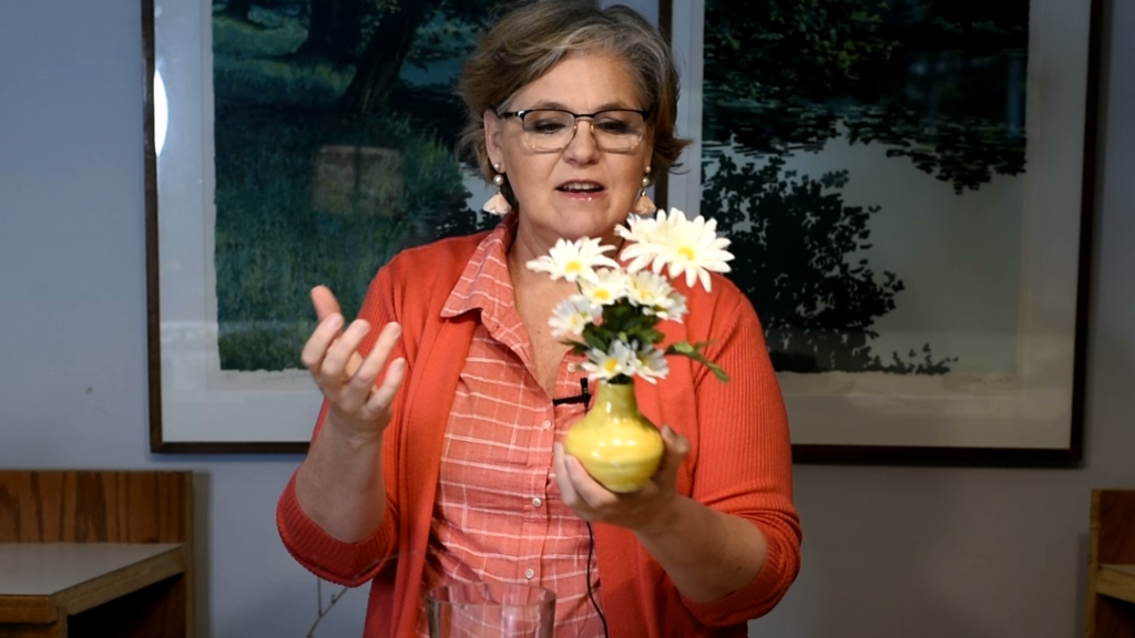 Sandra Forbes holding bud vase
