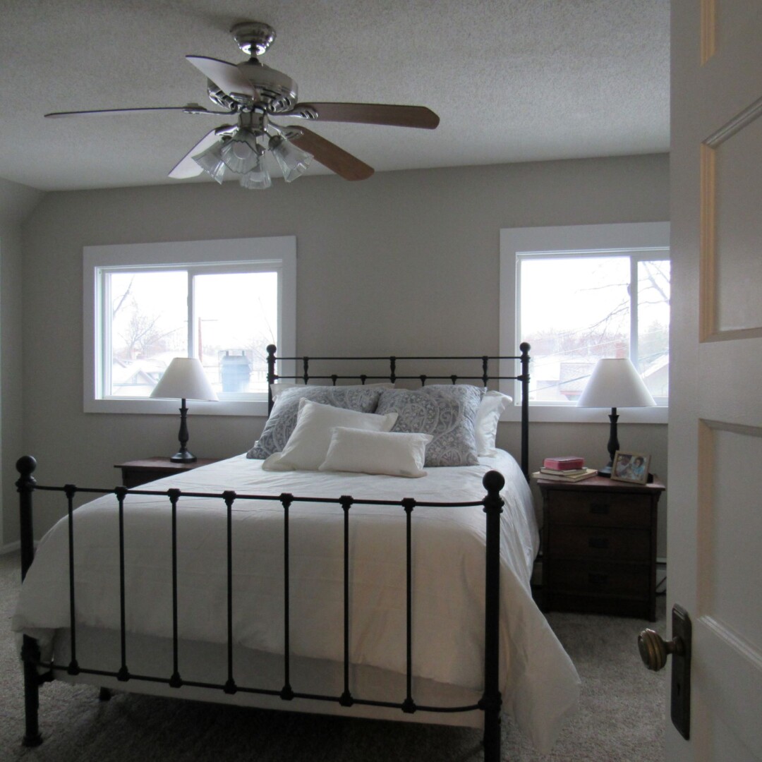 A fresh coat of paint, some new linens and some simple woodwork to closely mimic the woodwork of this 1920s home made a huge difference for this master bedroom.