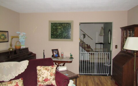 Edit furniture and remove pieces to open up the space to appear larger.