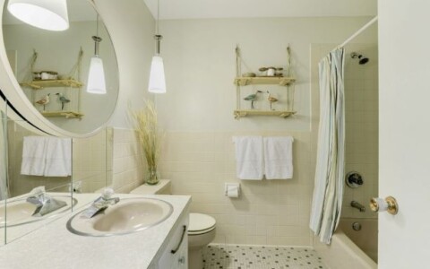 I bought a $20 fixture and created 2 pendant lights. Added some mirror squares and modern mirror. DIY rope shelf.